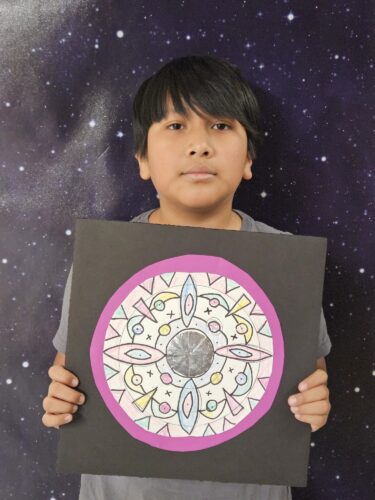 Anthony Chamizo shows off his artwork.