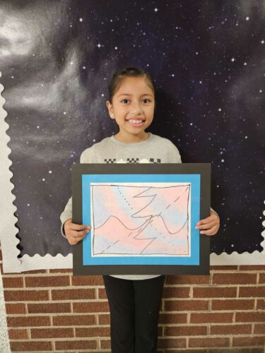Miranda Calderon shows off her artwork.