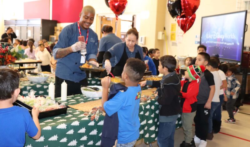 Chef Cam and Whitson's staff serve Kindergarteners and 1st graders during their lunch period.